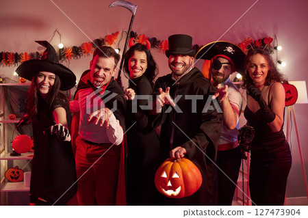 Happy Halloween holiday celebration friends group fun game, team wearing costumes for dress ups  127473904