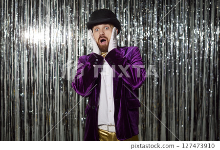 Portrait Of A Frightened Man In Purple Costume On A Shiny Background At A Party 127473910