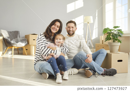 Happy family of three members enjoying Moving Day, relocate to new apartment Happy family of three members enjoying Moving Day, relocate to new apartment 127473927