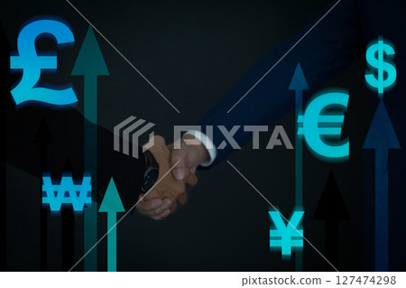 Closeup business people shaking hands overlay on currency symbol and growth arrow background. Business finance technology and investment concept 127474298