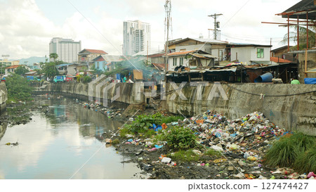 Philippine slum poor river garbage waste shanty landfill waste pollution fecal wastewater house densely populated people hungry people family poverty Cebu Mandaue City dirty trash stream village Philippine slum poor river garbage waste shanty landfill waste pollution fecal wastewater house densely populated people hungry people family poverty Cebu Mandaue City dirty trash stream village 127474427