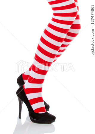 Woman with long legs and stockings over isolated background 127474862
