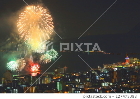 Beppu city at night and fireworks Beppu city at night and fireworks 127475388