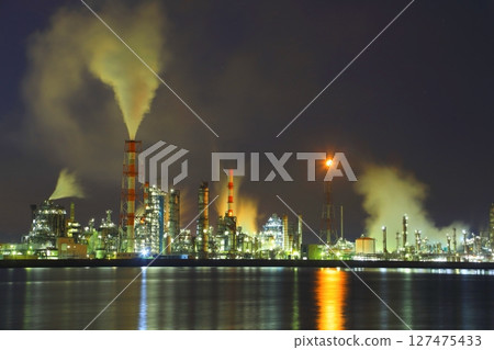 Waterfront factory at night 127475433