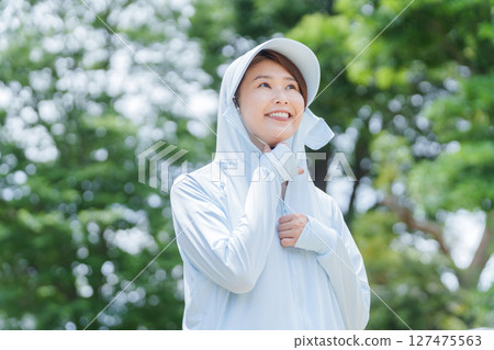 A woman wearing a rash guard to protect herself from UV rays A woman wearing a rash guard to protect herself from UV rays 127475563