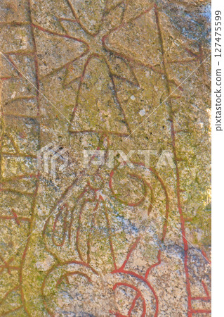 Rune stone in Sweden from the viking ages, about a thousand years old 127475599