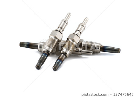 Close-Up of Metal Glow Plugs for Diesel Engines on White Background Close-Up of Metal Glow Plugs for Diesel Engines on White Background 127475645