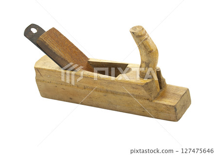 A vintage wooden hand plane, a classic carpentry tool on a white background. A vintage wooden hand plane, a classic carpentry tool on a white background. 127475646