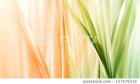 Gentle curves of overlapping leaves in shades of orange and green create a soothing abstract background 127476310