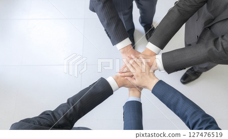 Businessmen forming a circle to achieve success Businessmen forming a circle to achieve success 127476519