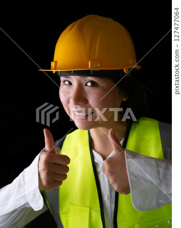 factory woman workers or technicians civil Engineer or Architecture project management give thumb up. factory woman workers or technicians civil Engineer or Architecture project management give thumb up. 127477064