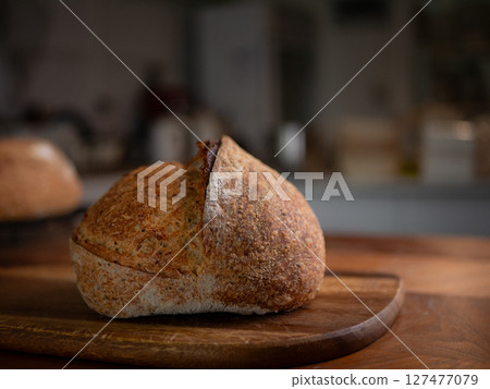 Crusty Artisan Sourdough Bread Close-Up. Crusty Artisan Sourdough Bread Close-Up. 127477079