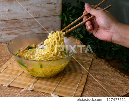 egg noodles with wonton roasted pork and crispy pork. 127477331