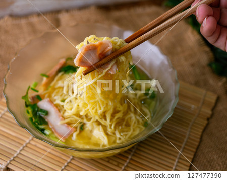 egg noodles with wonton roasted pork and crispy pork. 127477390