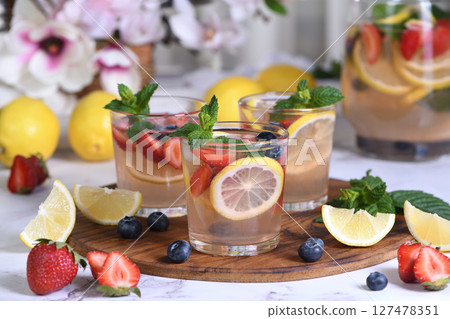 Lemonade with strawberries, blueberries and mint Lemonade with strawberries, blueberries and mint 127478351