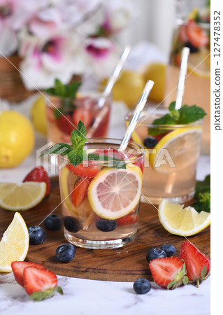 Lemonade with strawberries, blueberries and mint Lemonade with strawberries, blueberries and mint 127478352