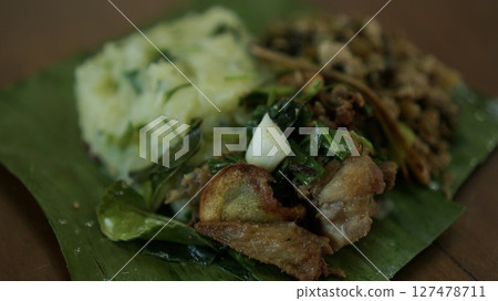 Northern Thailand's Aka tribal cuisine served on banana leaves in a casual dining setting Northern Thailand's Aka tribal cuisine served on banana leaves in a casual dining setting 127478711