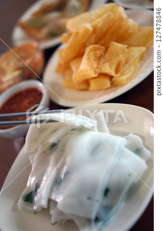 Flat Tai rice noodles boiled with dipping sauce from Shan state, Myanmar Flat Tai rice noodles boiled with dipping sauce from Shan state, Myanmar 127478846