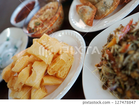 Flat Tai rice noodles, tea leaf salad and fried dumplings from Shan state, Myanmar Flat Tai rice noodles, tea leaf salad and fried dumplings from Shan state, Myanmar 127478847