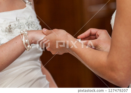 An Intimate Wedding Moment The Beautiful Exchange of Rings Filled with Love and Joy An Intimate Wedding Moment The Beautiful Exchange of Rings Filled with Love and Joy 127479207