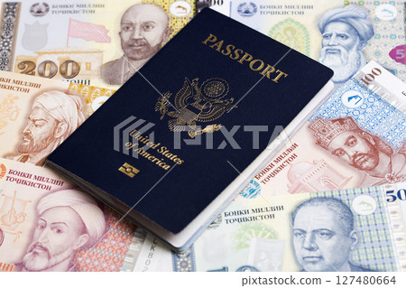 American passport onTajikistani Somoni 127480664