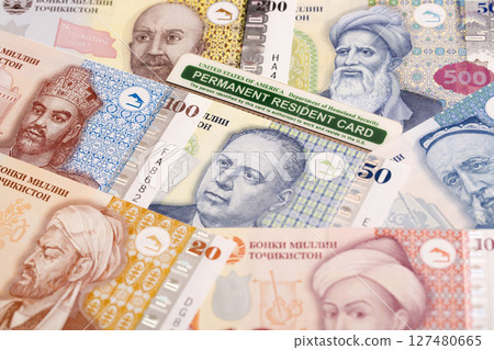 American Permanent Resident Card on Tajikistani money - somoni 127480665