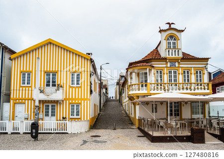 Street with colorful houses. Street with striped houses, Costa Nova, Aveiro, Portugal Street with colorful houses. Street with striped houses, Costa Nova, Aveiro, Portugal 127480816