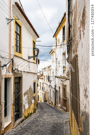 Typical Portuguese facades and cobblestone streets in Elvas, Portugal. Typical Portuguese facades and cobblestone streets in Elvas, Portugal. 127480854