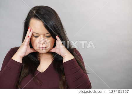 Worried woman having painfull headache Worried woman having painfull headache 127481367