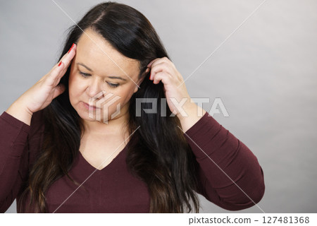 Worried woman having painfull headache Worried woman having painfull headache 127481368