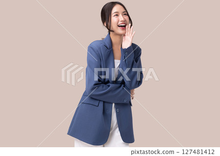 Portrait of happy young business woman posing open mouth isolated on brown background. Portrait of happy young business woman posing open mouth isolated on brown background. 127481412