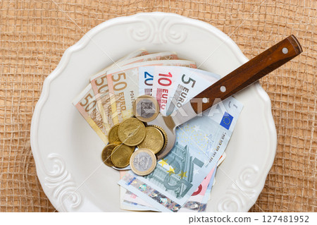 Euro money on kitchen table, cost of living 127481952