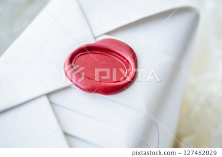 Wax seal stamp on white paper wrap packaging parcel box 127482029