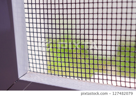 mosquito net wire screen on house window protection against insect 127482079