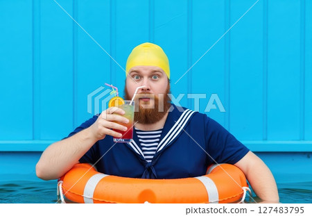 Surprised Swimmer With Summer Drink Surprised Swimmer With Summer Drink 127483795