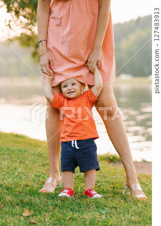 Smiling Toddler Holding Parent Hands Smiling Toddler Holding Parent Hands 127483913