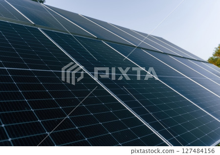 At sunny daytime. Close-up view of solar cell farm power plant eco technology At sunny daytime. Close-up view of solar cell farm power plant eco technology 127484156