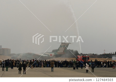 An EC-1 electronic warfare aircraft passes through a water cannon at a retirement ceremony. An EC-1 electronic warfare aircraft passes through a water cannon at a retirement ceremony. 127484503
