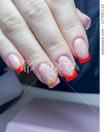 Nail extensions, manicure, nail correction, hands in the foreground gel polishes Nail extensions, manicure, nail correction, hands in the foreground gel polishes 127485110