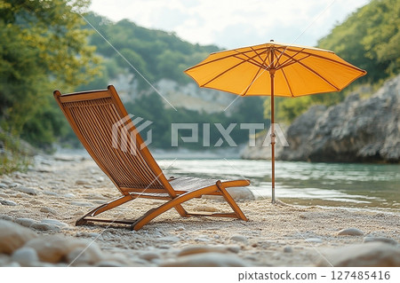 Summer discovery. Sunny day. Umbrella and chairs set up on sand in beach of ocean. 127485416