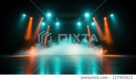 Empty concert stage with dramatic teal and orange spotlights and rising smoke 127485823