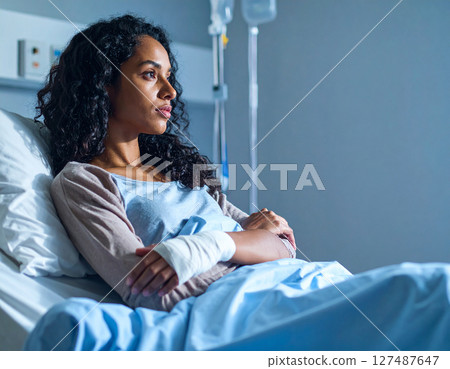 A young lady sleeping on bed 127487647