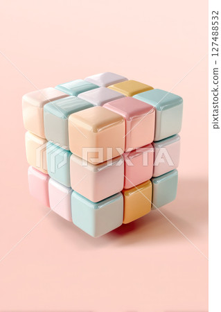 Colorful pastel cube puzzle with glossy finish, arranged on a soft pink background, showcasing playful design and vibrant aesthetic appeal 127488532