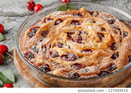 baked filo pastry pie with cherries and custard close-up in glass bowl. horizontal 127489410