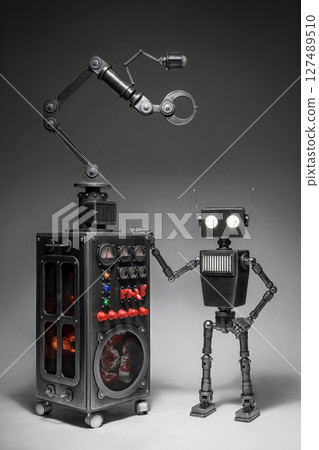 Humanoid robot on a dark background.  127489510