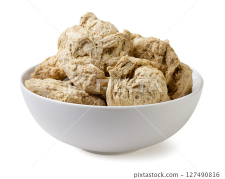 Soya chunks in a plate close-up on a white background. Isolated Soya chunks in a plate close-up on a white background. Isolated 127490816