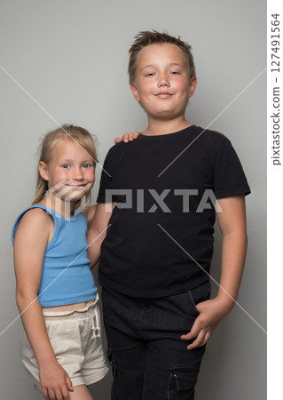 Smiling brother and sister friendship. Childhood and  happiness Smiling brother and sister friendship. Childhood and  happiness 127491564