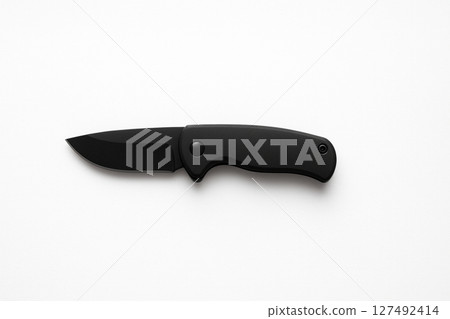 A simple black outdoor knife on a white background 127492414