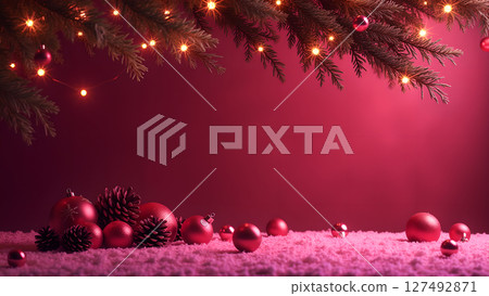 Festive christmas background with red ornaments and pine branch with light 127492871