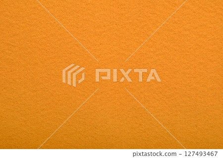 Orange felt texture background - close-up of soft fabric surface. Seamless background, graphic design, scrapbooking, textile layouts, creative projects. 127493467